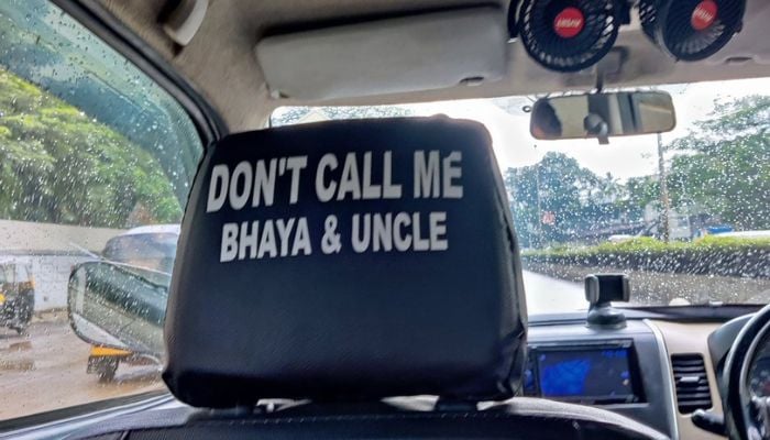 Cab with a notice on the passenger seat. —  Twitter