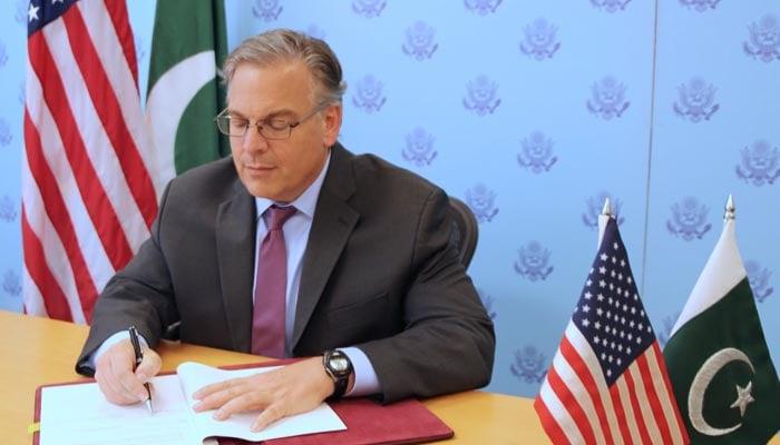 US Ambassador Donald Blome signs the second US-Pakistan bilateral agreement on September 30, 2022. — Twitter