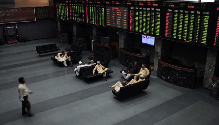 Investors can be seen sitting in the main hall of the Pakistan Stock Exchange. — PSX