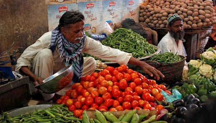 A representational image of a vegetable seller selling vegetables. — Reuters/File