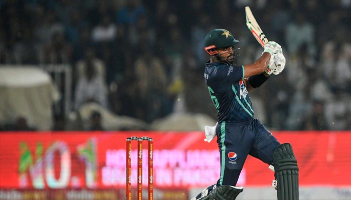 Pakistan´s captain Babar Azam plays a shot during the sixth Twenty20 international cricket match between Pakistan and England at the Gaddafi Cricket Stadium in Lahore on September 30, 2022. — AFP