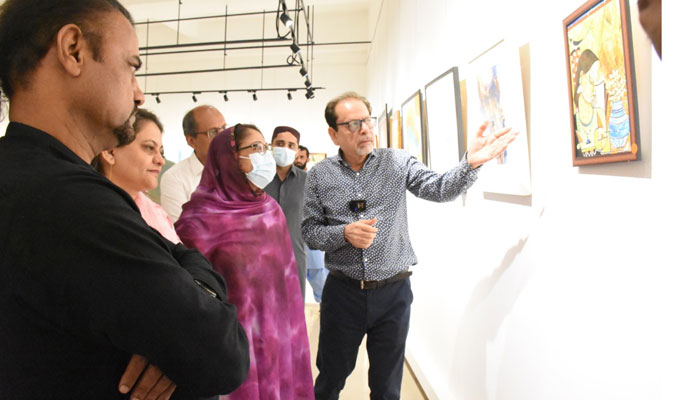 President Arts Council of Pakistan briefing PPP leader Faryal Talpur in an exhibition held for floof victims. PR