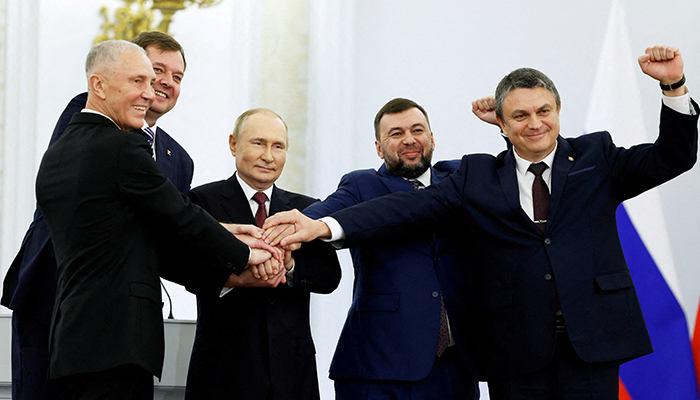 Russian President Vladimir Putin and Denis Pushilin, Leonid Pasechnik, Vladimir Saldo, and Yevgeny Balitsky, who are the Russian-installed leaders in Ukraines Donetsk, Luhansk, Kherson and Zaporizhzhia regions, attend a ceremony to declare the annexation of the Russian-controlled territories of four Ukraines Donetsk, Luhansk, Kherson and Zaporizhzhia regions, after holding what Russian authorities called referendums in the occupied areas of Ukraine that were condemned by Kyiv and governments worldwide, in the Georgievsky Hall of the Great Kremlin Palace in Moscow, Russia, September 30, 2022. — Reuters