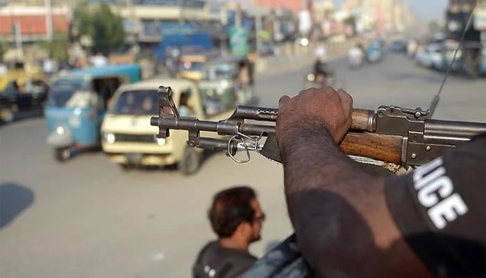 A policeman stands guard on a street in Karachi in this undated photo. — AFP/File