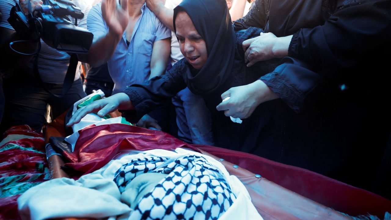 People mourn during the funeral of seven-year-old Rayyan Suleiman. — Reuters