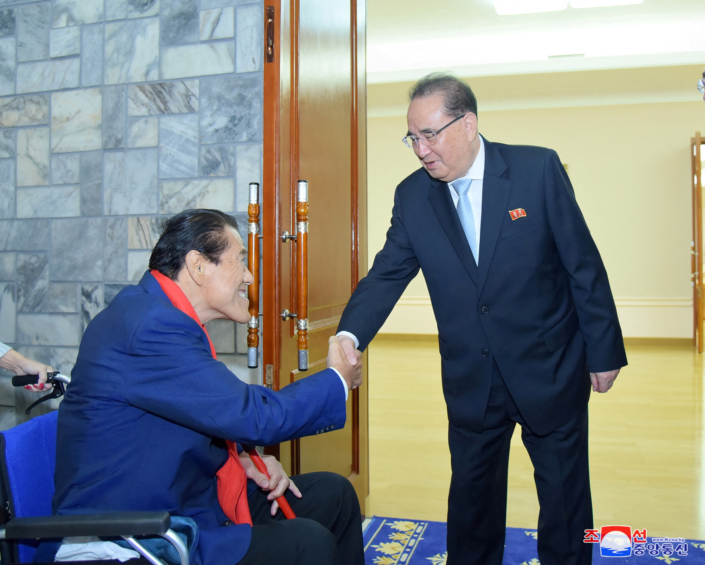 Japanese politician Antonio Inoki (L) shakes hands with a North Korean official in this undated photo released September 15, 2018 by North Koreas Korean Central News Agency. — KCNA via Reuters