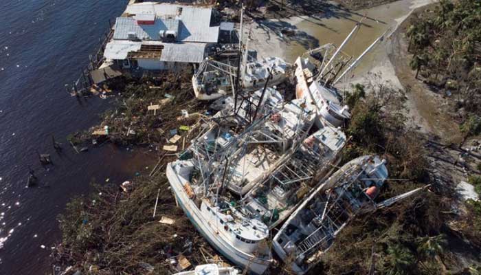Stranded shrimp boats are seen in a marina after Hurricane Ian caused widespread destruction in Fort Myers Beach, Florida, U.S., September 30, 2022. Photo: Reuters