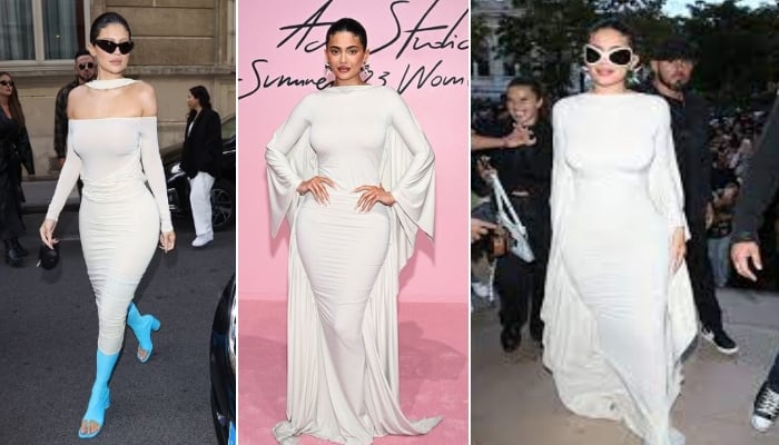 Kylie Jenner adalah visi dalam pakaian putih saat dia memamerkan sosok jam pasirnya di Paris Fashion Week