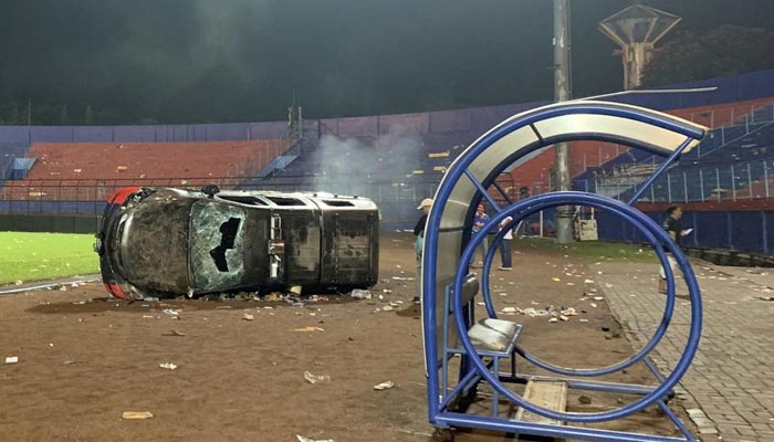 A damaged car is pictured following a riot after the league BRI Liga 1 football match between Arema vs Persebaya at Kanjuruhan Stadium, Malang, East Java province, Indonesia, October 2, 2022. — Reuters/File