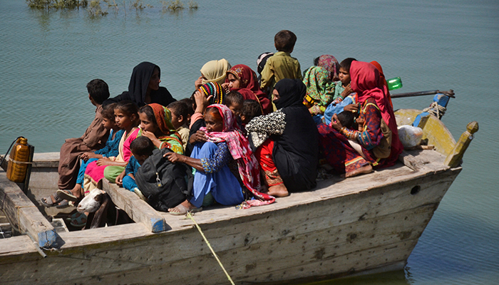 People, displaced because of the floods, travel on a boat as they head back to their village, following rains and floods during the monsoon season in Sehwan, Pakistan September 20, 2022. — Reuters