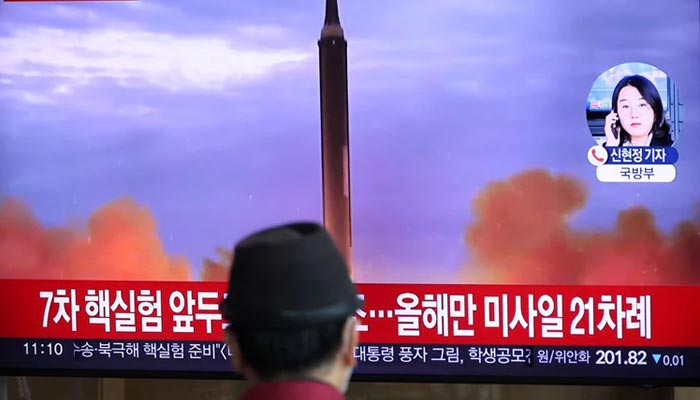 A man watches a TV broadcasting a news report on North Korea firing a ballistic missile over Japan, at a railway station in Seoul, South Korea, October 4, 2022. — Reuters
