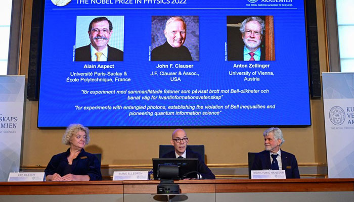 Secretary General of the Royal Swedish Academy of Sciences Hans Ellegren, Eva Olsson and Thors Hans Hansson, members of the Nobel Committee for Physics announce the winners of the 2022 Nobel Prize in Physics Alain Aspect, John F. Clauser and Anton Zeilinger, during a news conference at The Royal Swedish Academy of Sciences in Stockholm, Sweden, October 4, 2022. — Reuters