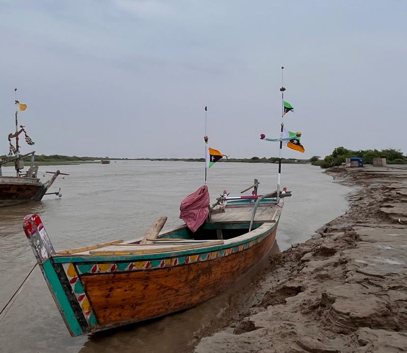 A boat can be seen parked near a creek in Kharo Chan after seawater made its way to the Indus River after several years. Photo taken on September 12, 2022. — Photo by author
