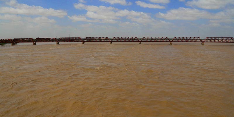 A view of increased water at Indus River after flooding at Kotri Bridge, on September 2, 2022. — APP