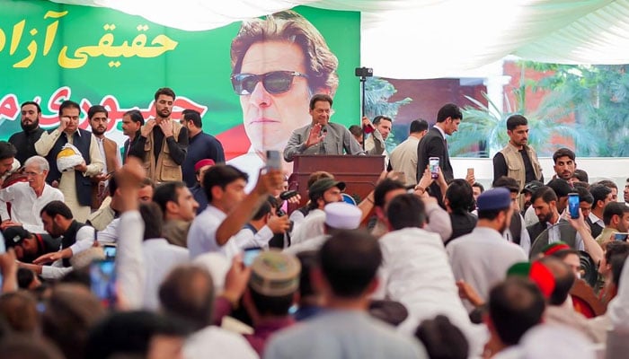 Imran Khan addressing the partys leaders and workers in Peshawar on October 4, 2022. Twitter/ShibliFaraz