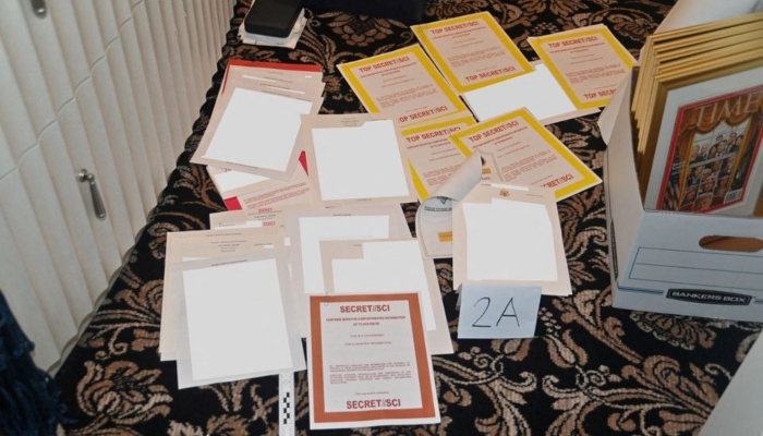 A redacted FBI photograph of documents and classified cover sheets recovered from a container stored in former U.S. president Donald Trumps Florida estate, and which was included in a U.S. Department of Justice filing and released August 30, 2022. — Reuters/File
