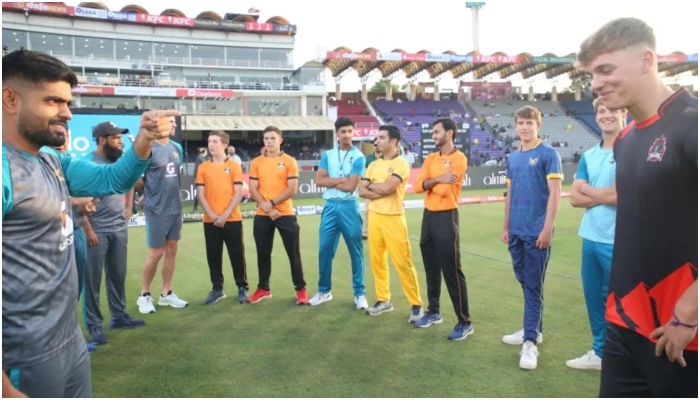 Babar Azam interacts with some of the overseas PJL players at the Gaddafi Stadium. — PCB