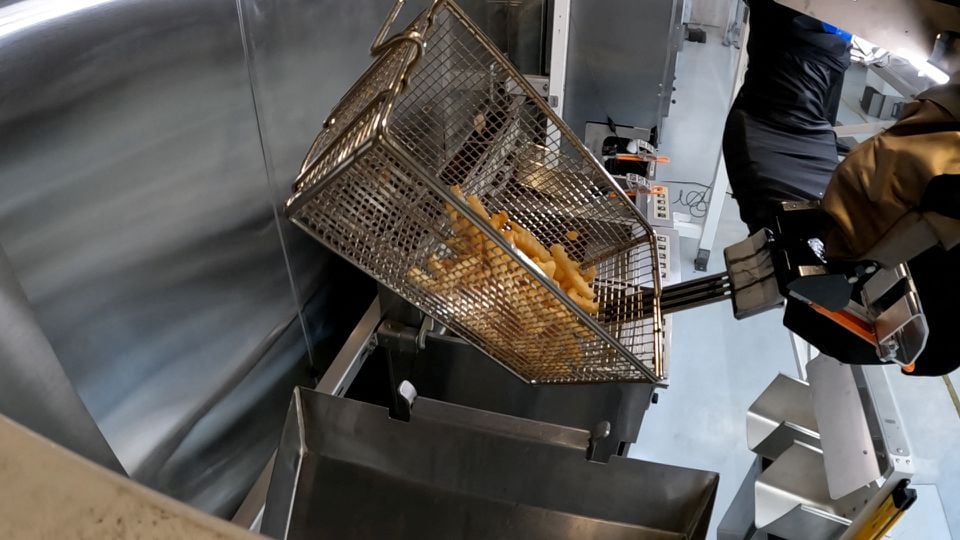 The Flippy 2 robot takes fries out of a vat of oil at a lab of manufacturer Miso Robotics Inc in Pasadena, California, U.S. September 27, 2022 in this screen grab from a REUTERS video.