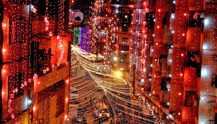 A picture taken on October 28, 2020, shows an illuminated street in a residential area ahead of celebrations for Eid-e-Milad-un-Nabi in Karachi. — AFP