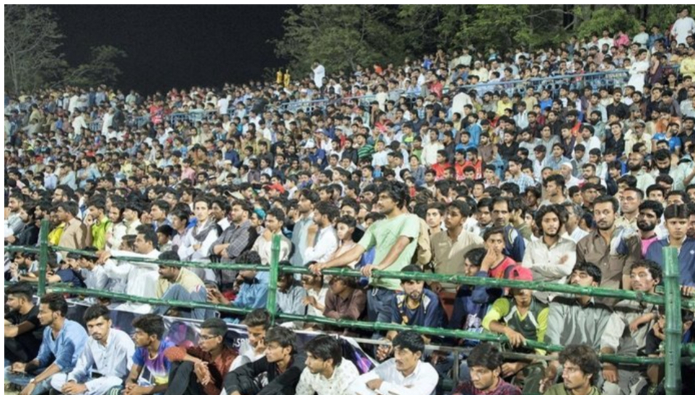 Crowd watching tape-ball cricket. — Twitter