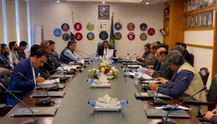Interior Minister Rana Sanaullah chairs a meeting of a high-powered committee formed to probe the security breach at the PM House in Islamabad on October 7, 2022. — Screengrab