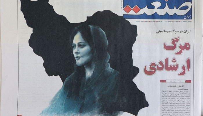 A newspaper with a cover picture of Mahsa Amini, a woman who died after being arrested by the Islamic republics morality police is seen in Tehran, Iran September 18, 2022. — Reuters