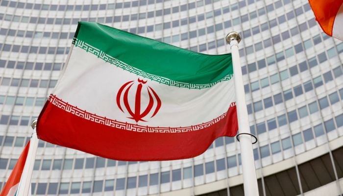 The Iranian flag waves in front of the International Atomic Energy Agency (IAEA) headquarters in Vienna, Austria May 23, 2021.—  Reuters