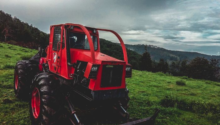 (representational) Red and Black Bulldozer in Grass Field. — Pexel