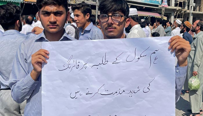Students and teachers of private schools take part in a protest against recent attack in Mingora on October 10, 2022. — AFP