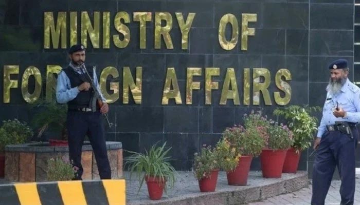 Two guards stand outside of the Ministry of Foreign Affairs office in Islamabad, Pakistan. — AFP