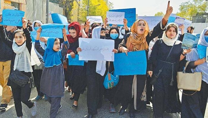Afghan women and girls stage protest in front of the Ministry of Education in Kabul on March 26, 2022, demanding that high schools be reopened for girls. — AFP/File