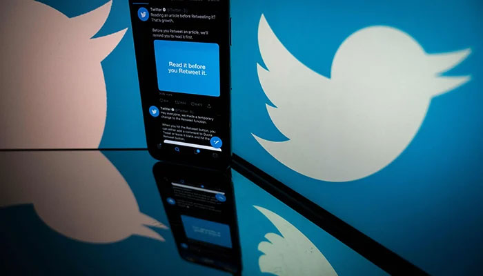 In this file photo taken on October 26, 2020, the logo of US social network Twitter displayed on the screen of a smartphone and a tablet in Toulouse, southern France. Twitter on December 2, 2021. — AFP/File