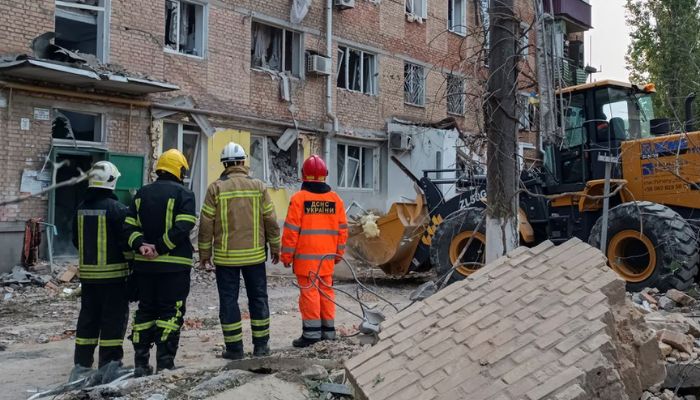 Rescuers work at the site of an apartment building damaged by a Russian military strike, as Russias attack on Ukraine continues in Mykolaiv October 13, 2022.— Reuters