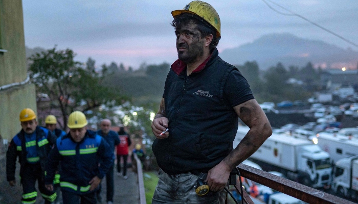 Relatives and friends of mine workers wait outside a coal mine after an explosion in Amasra, in Bartin Province, Turkey, on October 15, 2022. — AFP