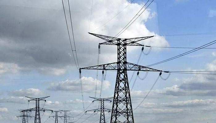 Govt denies increasing power tariff for consumers - Financeupdates 1 Electricity transmission cables and towers. — APP/File