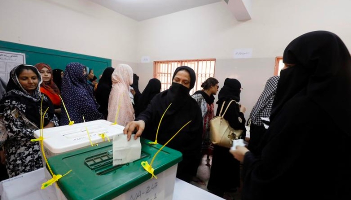 Female voters cast their votes in Karachi. — Reuters/File