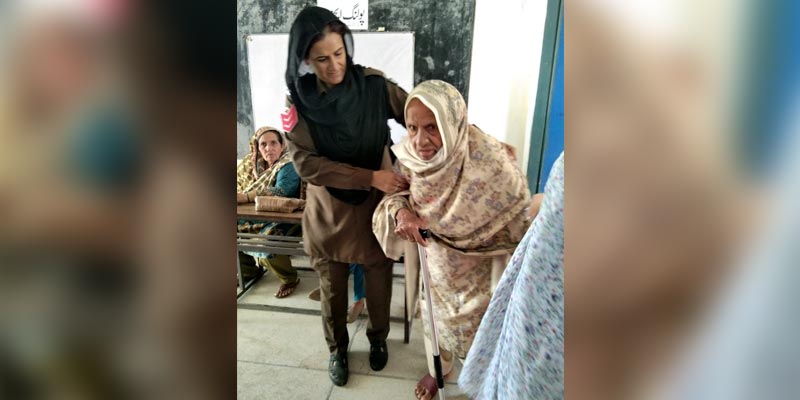 In this photo shared by the ECP spokesperson, an elderly woman is seen arriving at the polling station to cast her vote in by-elections, on October 16, 2022. — ECP/Twitter