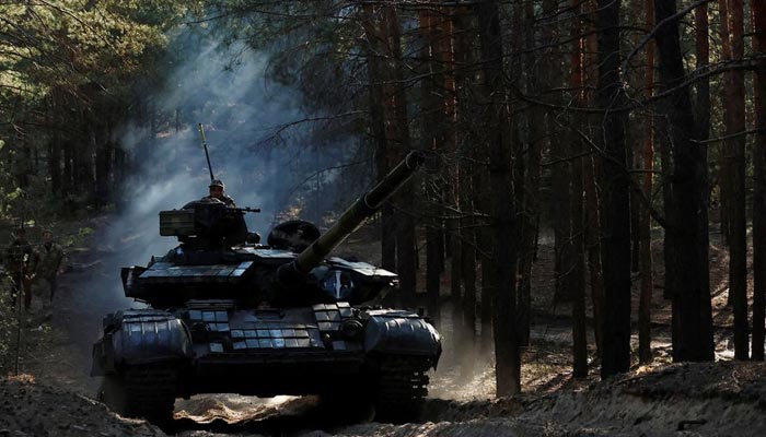 Ukrainian soldiers drive a captured Russian tank after re-fitting it for use in battle, in Kupiansk region of Kharkiv Oblast, Ukraine, October 15, 2022. — Reuters/File
