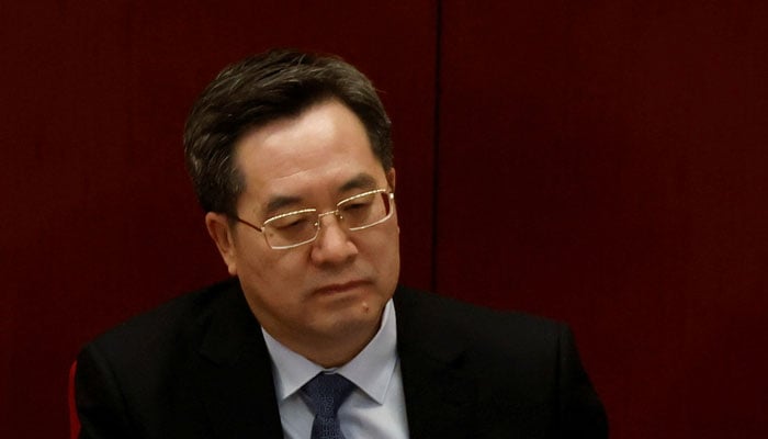 سنٹرل کمیٹی کے جنرل آفس کے ڈائریکٹر ڈنگ زیو ژیانگ نے 4 مارچ 2021 کو بیجنگ، چین میں عظیم ہال آف دی پیپل میں چینی عوامی سیاسی مشاورتی کانفرنس (CPPCC) کے افتتاحی اجلاس میں شرکت کی۔ — رائٹرز/فائل