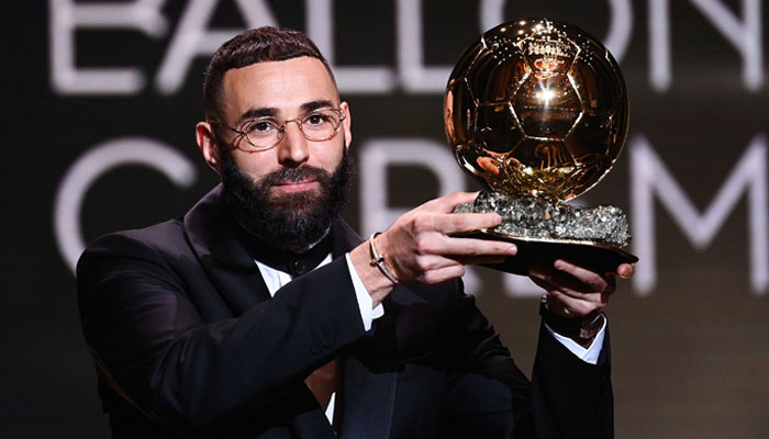 Real Madrids French forward Karim Benzema receives the Ballon dOr award during the 2022 Ballon dOr France Football award ceremony at the Theatre du Chatelet in Paris on October 17, 2022. — AFP