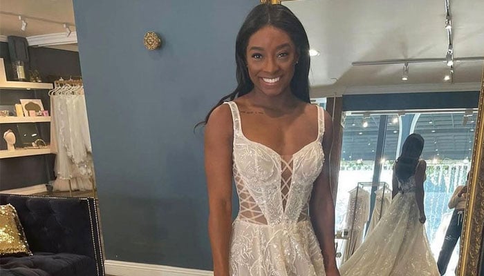 Simone Biles chooses two wedding dresses from a popular Israeli designer