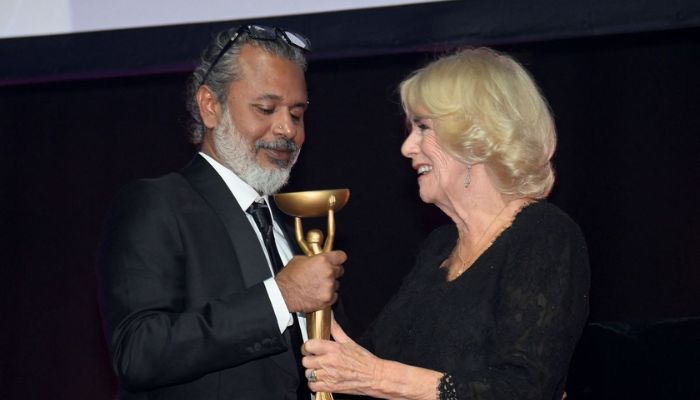 Britains Queen Camilla presents winner Shehan Karunatilaka with trophy for The Seven Moons of Maali Almeida at the Booker Prize for Fiction 2022 awards ceremony, in London, Britain, October 17, 2022.— Reuters