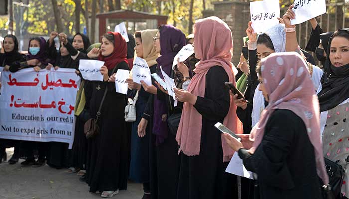 Afghan women hold placards during a protest in front of Kabul University in Kabul on October 18, 2022. — AFP/File