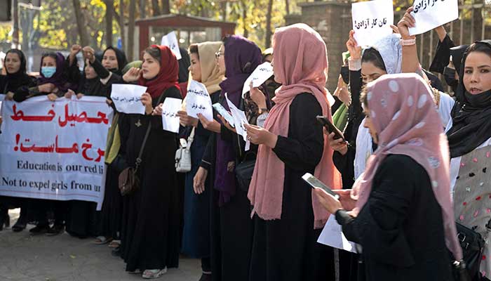 Afghan women hold placards during a protest in front of Kabul University in Kabul on October 18, 2022. — AFP/File