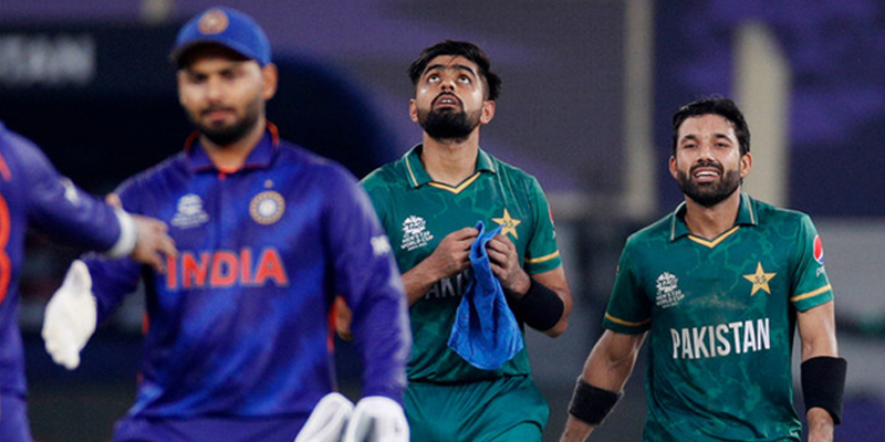 Pakistans Mohammad Rizwan (R) and Babar Azam (2R) celebrate after winning the match against India in Dubai, UAE, on October 24, 2021. — Reuters