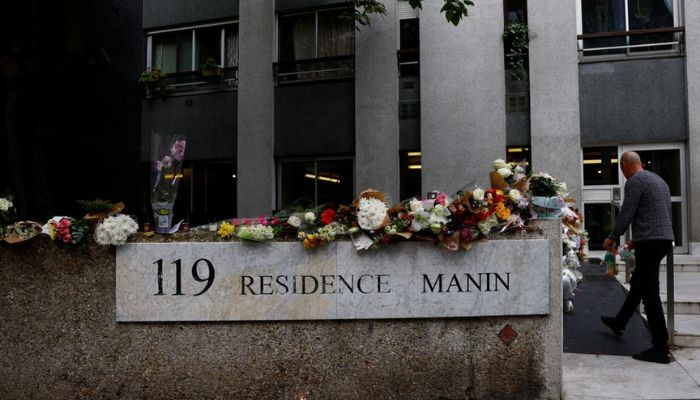 Flowers and messages are displayed outside the building where a 12-year-old schoolgirl Lola lived, who was brutally killed and whose body was stuffed in a trunk in the 19th district in Paris, France, October 18, 2022.— Reuters