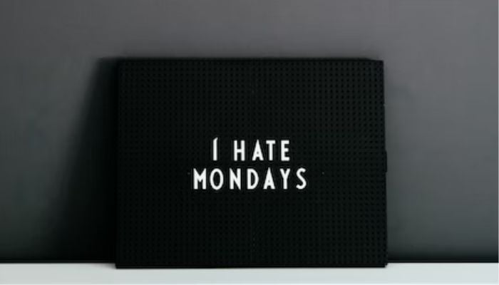 A pillow that reads I hate Mondays. — Unsplash