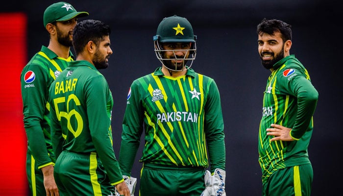 Pakistans captain Babar Azam (L) talks to his teammates Usman Qadir (C) and Shadab Khan during the ICC mens Twenty20 World Cup 2022 warm-up match between Afghanistan and Pakistan at the Gabba in Brisbane on October 19, 2022. — AFP