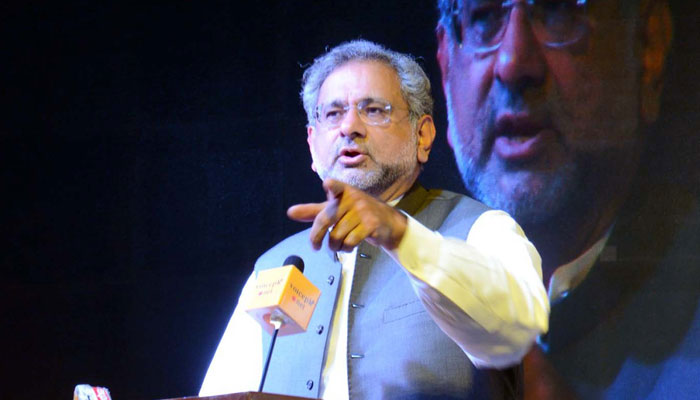 Former prime minister Shahid Khaqan Abbasi addressing a seminar in this undated photo. — PPI/File