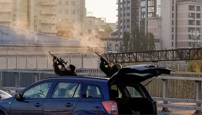 Police officers shoot at a drone during a Russian drone strike, which local authorities consider to be Iranian-made Shahed-136 unmanned aerial vehicles (UAVs), amid Russias attack on Ukraine, in Kyiv, Ukraine October 17, 2022.— Reuters